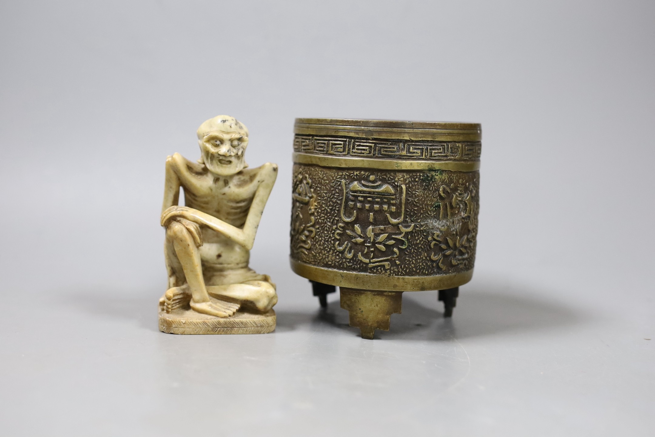 A Chinese archaistic bronze censer and a soapstone figure of a luohan, Tallest 10cm